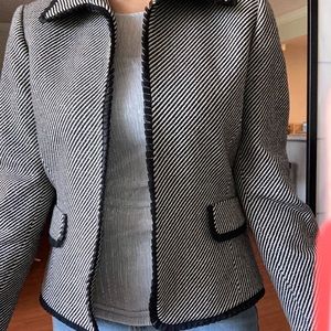 Shiny silver dressy jacket with black lining